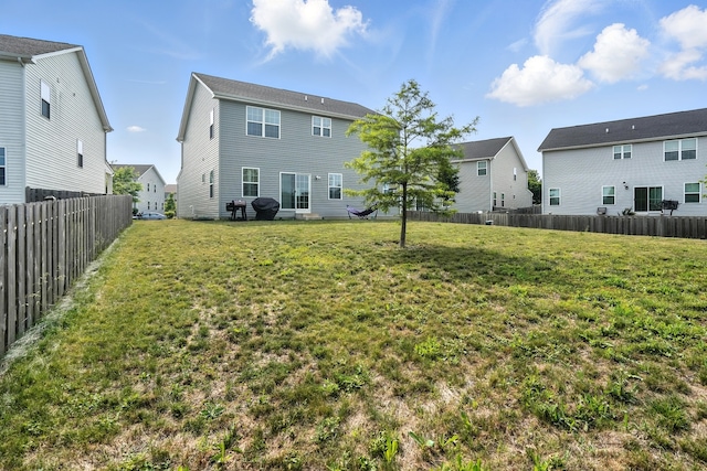 2632 Pecos Cir, Montgomery, IL 60538 - back of house featuring a fenced backyard and a residential view