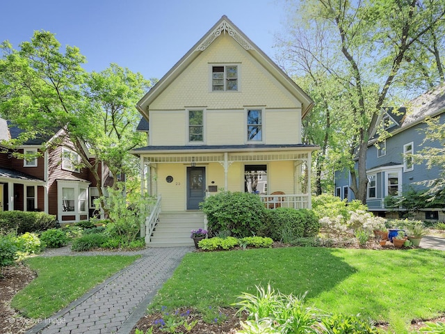 23 Blaine St, Hinsdale, IL 60521 - victorian home with a porch and a front yard