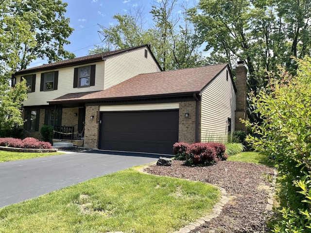 3485 Ronald Rd, Crete, IL 60417 - view of front of home featuring brick siding, an attached garage, driveway, and a chimney