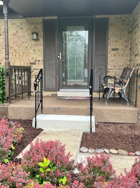 3485 Ronald Rd, Crete, IL 60417 - doorway to property featuring a porch and brick siding