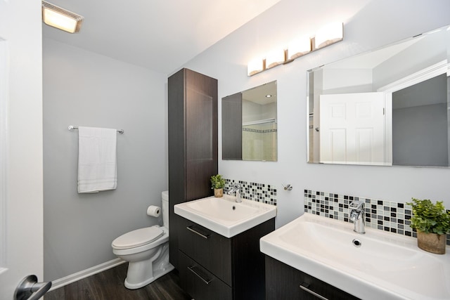 2208 W Concord Ln, Addison, IL 60101 - full bathroom featuring backsplash, wood finished floors, and two vanities