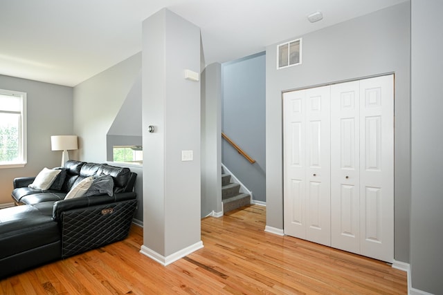 2208 W Concord Ln, Addison, IL 60101 - living area with light wood-style flooring, plenty of natural light, and stairway
