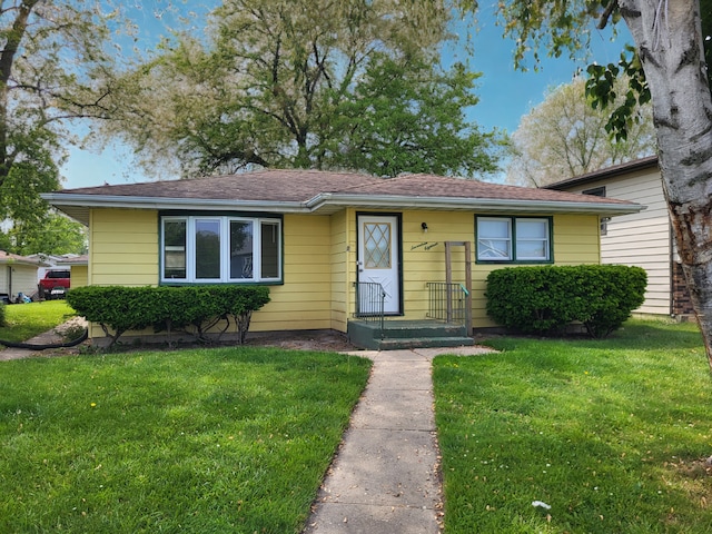 1718 Gilboa Ave, Zion, IL 60099 - bungalow-style house with a front lawn