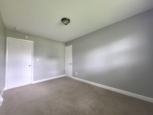 1718 Gilboa Ave, Zion, IL 60099 - spare room featuring dark carpet and a smoke detector