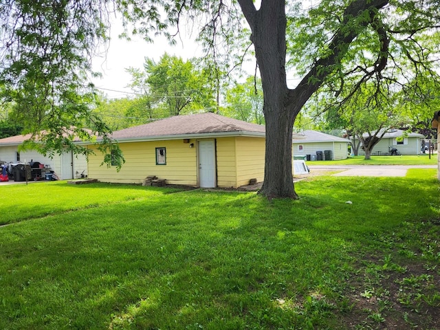 1718 Gilboa Ave, Zion, IL 60099 - view of home's exterior with a lawn