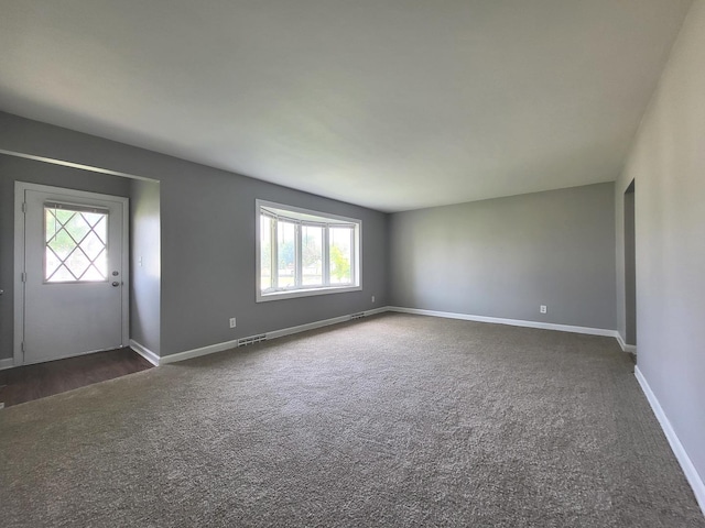 1718 Gilboa Ave, Zion, IL 60099 - unfurnished room featuring dark carpet