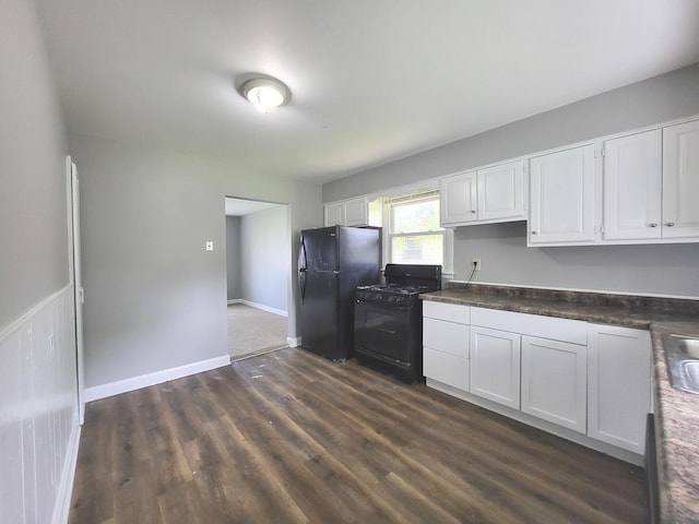 1718 Gilboa Ave, Zion, IL 60099 - kitchen with black appliances, dark wood-style floors, white cabinets, and dark countertops
