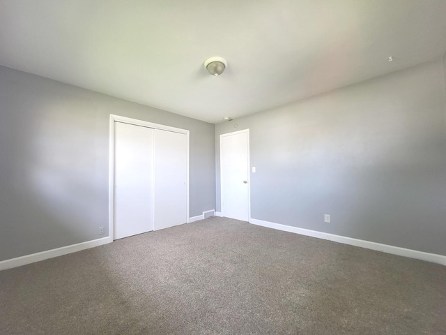 1718 Gilboa Ave, Zion, IL 60099 - unfurnished bedroom featuring a closet and carpet