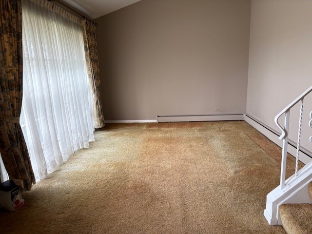 8801 Robin Dr Unit C, Des Plaines, IL 60016 - empty room featuring carpet, a baseboard radiator, and stairway