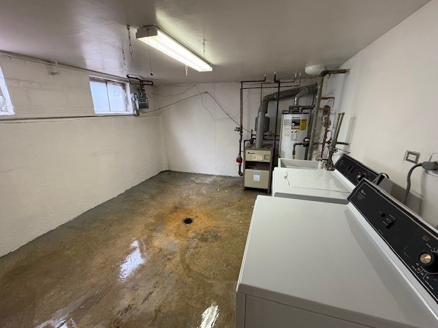 8801 Robin Dr Unit C, Des Plaines, IL 60016 - basement with water heater, independent washer and dryer, and a heating unit