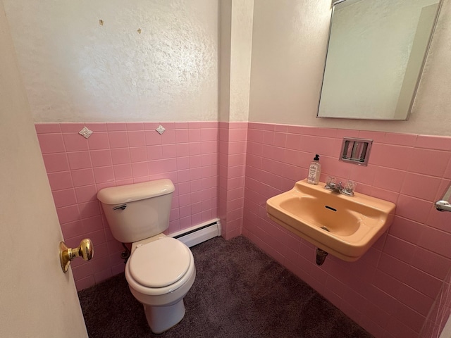 8801 Robin Dr Unit C, Des Plaines, IL 60016 - half bath featuring tile walls, a baseboard radiator, and wainscoting