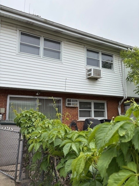 8801 Robin Dr Unit C, Des Plaines, IL 60016 - back of property featuring brick siding and cooling unit