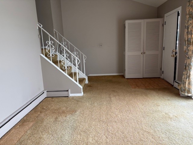 8801 Robin Dr Unit C, Des Plaines, IL 60016 - carpeted spare room featuring a baseboard heating unit, stairway, and lofted ceiling
