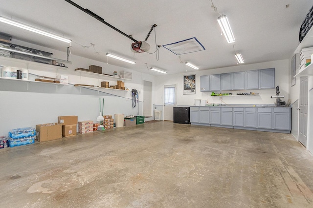 1910 Heather Ln, Joliet, IL 60431 - garage with a garage door opener and refrigerator
