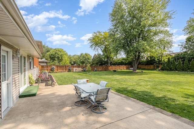 1910 Heather Ln, Joliet, IL 60431 - fenced backyard featuring a patio and outdoor dining space