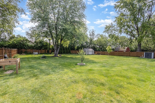 1910 Heather Ln, Joliet, IL 60431 - fenced backyard with a shed and a fire pit