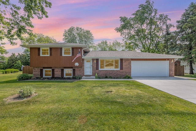 1910 Heather Ln, Joliet, IL 60431 - split level home featuring an attached garage, driveway, brick siding, and a front lawn
