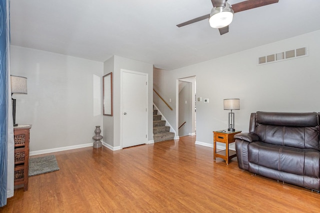 1910 Heather Ln, Joliet, IL 60431 - living area featuring stairway, light wood-style flooring, and ceiling fan