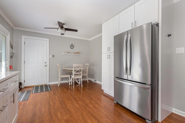 1910 Heather Ln, Joliet, IL 60431 - kitchen featuring freestanding refrigerator, ceiling fan, wood finished floors, white cabinetry, and ornamental molding