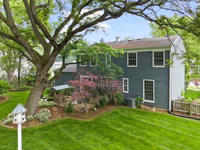 116 W Bailey Rd, Naperville, IL 60565 - rear view of property with a patio area and a chimney