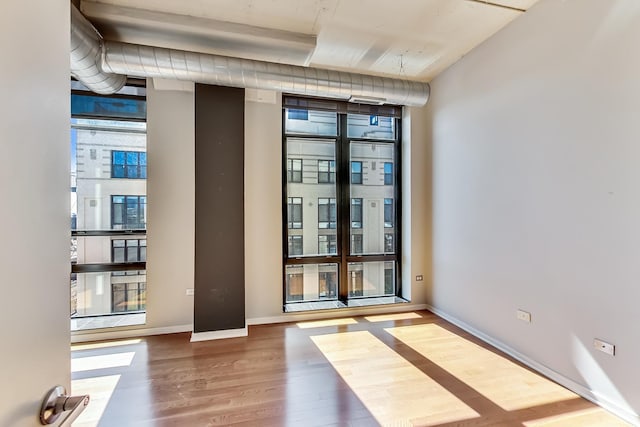 1525 S Sangamon St Unit 609, Chicago, IL 60608 - empty room featuring wood finished floors and baseboards