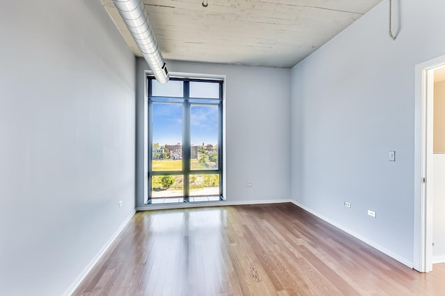 1525 S Sangamon St Unit 609, Chicago, IL 60608 - empty room featuring wood finished floors and baseboards