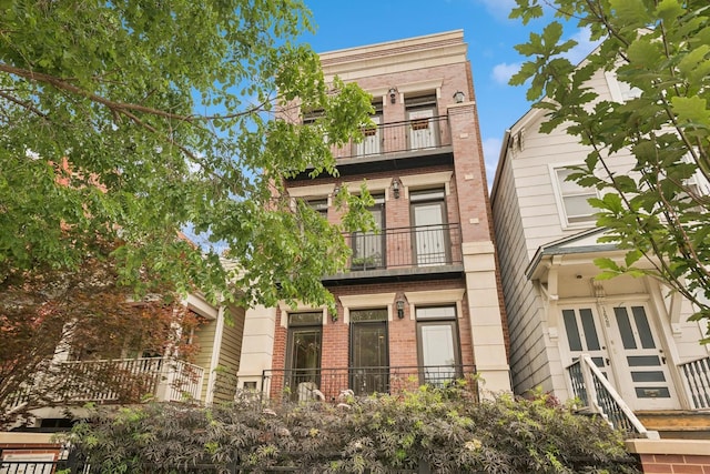 1430 W Diversey Pkwy Unit 1, Chicago, IL 60614 - view of front of home with a balcony and brick siding