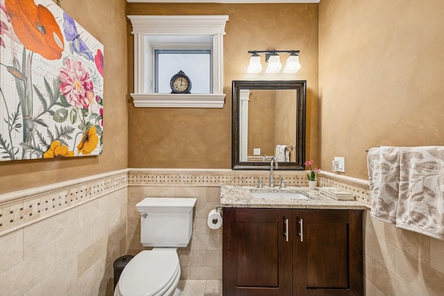 1430 W Diversey Pkwy Unit 1, Chicago, IL 60614 - bathroom featuring tile walls, vanity, and wainscoting