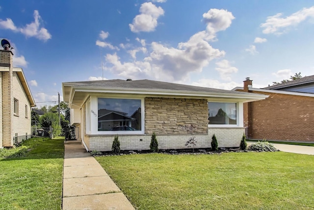8433 W Betty Ter W, Niles, IL 60714 - view of front facade with a front yard and brick siding