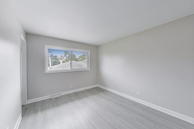8433 W Betty Ter W, Niles, IL 60714 - empty room with wood finished floors and baseboards