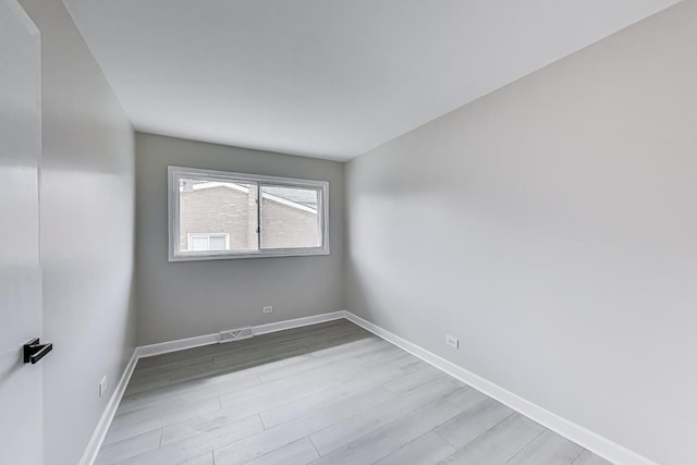 8433 W Betty Ter W, Niles, IL 60714 - unfurnished room with wood finished floors and baseboards