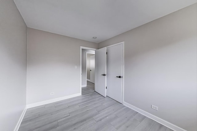 8433 W Betty Ter W, Niles, IL 60714 - spare room with baseboards and light wood finished floors
