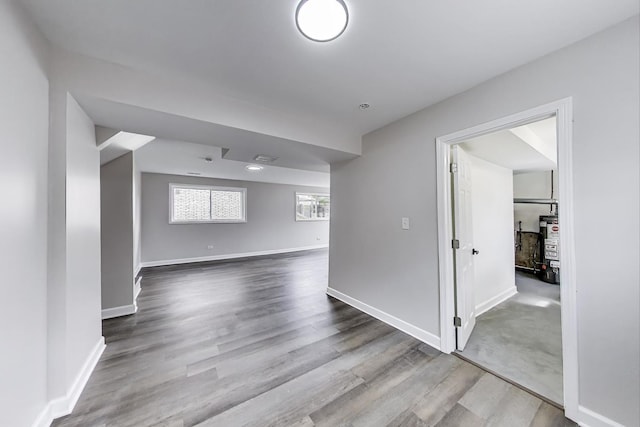 8433 W Betty Ter W, Niles, IL 60714 - empty room featuring wood finished floors and water heater