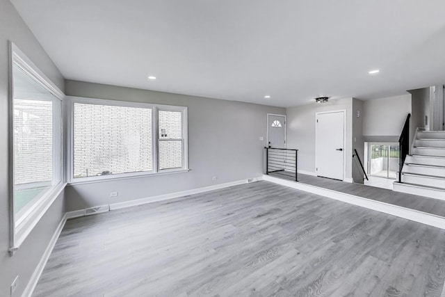 8433 W Betty Ter W, Niles, IL 60714 - unfurnished living room featuring wood finished floors and recessed lighting