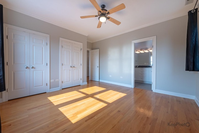 3454 N Ashland Ave Unit 4S, Chicago, IL 60657 - unfurnished bedroom with multiple closets, light wood finished floors, ornamental molding, ensuite bath, and ceiling fan