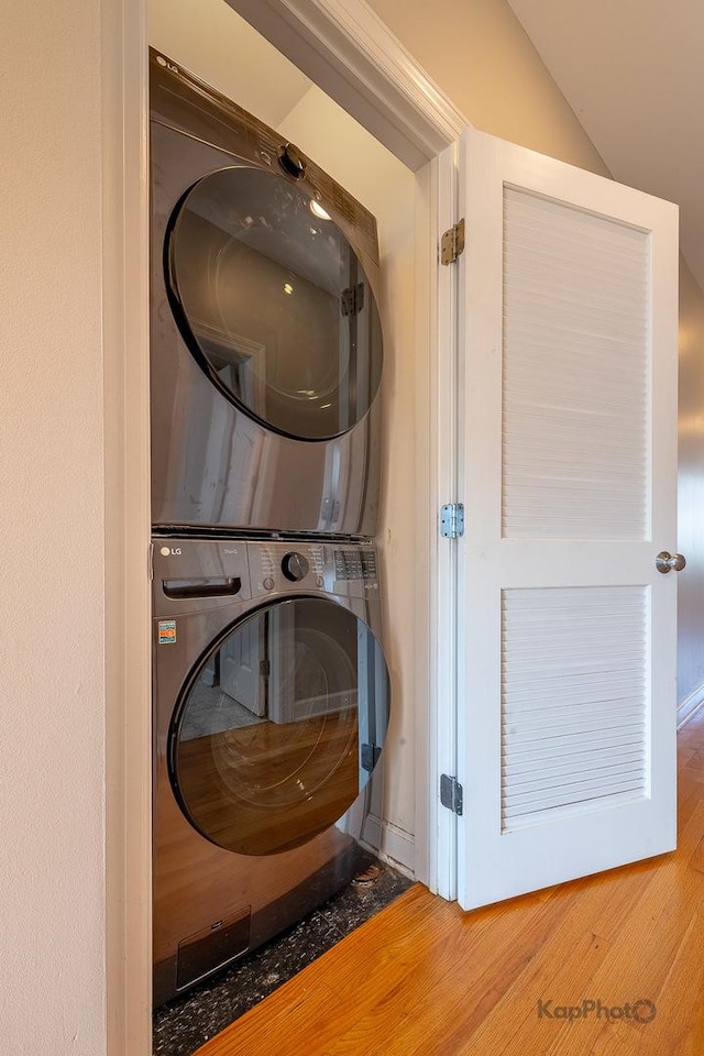 3454 N Ashland Ave Unit 4S, Chicago, IL 60657 - laundry area with estacked washer and dryer and wood finished floors