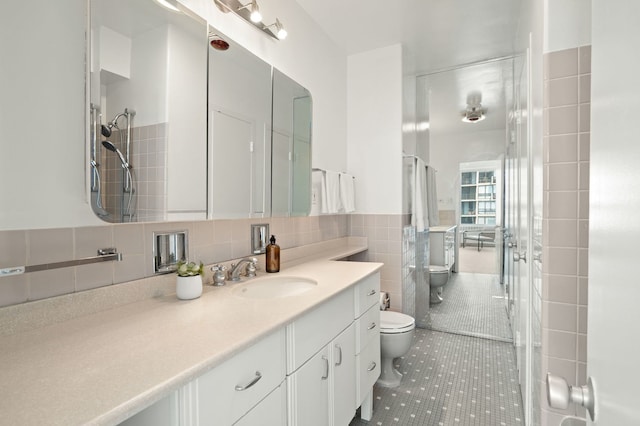 3180 N Lake Shore Dr Unit 8A, Chicago, IL 60657 - full bath featuring vanity, a shower, tile walls, and tile patterned floors