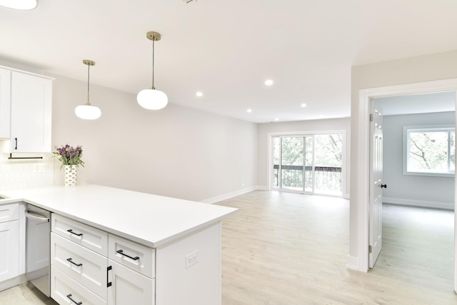 1400 N Elmhurst Rd Unit 310, Mount Prospect, IL 60056 - kitchen with stainless steel dishwasher, light wood-type flooring, a peninsula, white cabinets, and recessed lighting