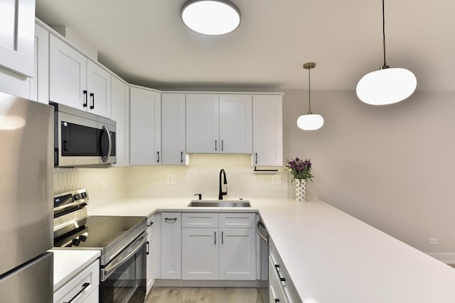 1400 N Elmhurst Rd Unit 310, Mount Prospect, IL 60056 - kitchen with stainless steel appliances, backsplash, light countertops, and light wood finished floors