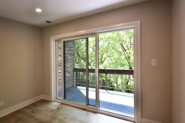 1400 N Elmhurst Rd Unit 310, Mount Prospect, IL 60056 - doorway to outside with wood finished floors and recessed lighting