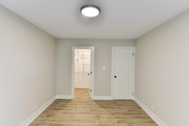 1400 N Elmhurst Rd Unit 310, Mount Prospect, IL 60056 - spare room with light wood-style flooring and baseboards