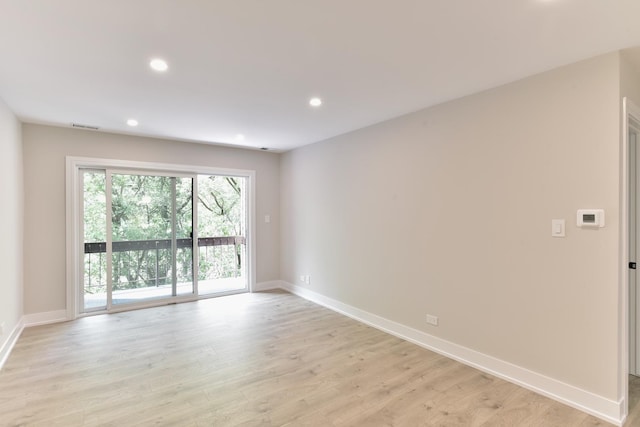1400 N Elmhurst Rd Unit 310, Mount Prospect, IL 60056 - unfurnished room with light wood-style flooring and recessed lighting