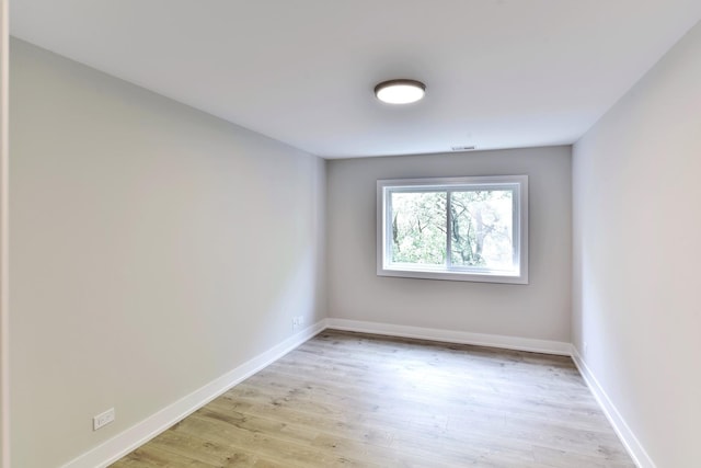 1400 N Elmhurst Rd Unit 310, Mount Prospect, IL 60056 - unfurnished room with baseboards and light wood-style floors
