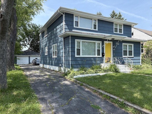 409 W 15th St, Chicago Heights, IL 60411 - traditional style home with a detached garage, an outbuilding, and a front lawn