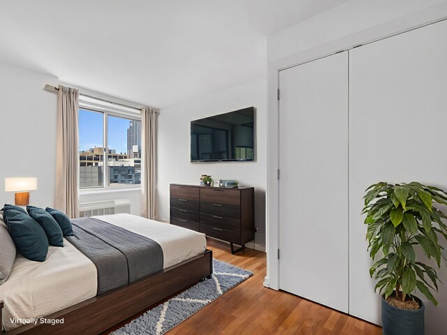 211 E Ohio St Unit 2707, Chicago, IL 60611 - bedroom featuring light wood-type flooring