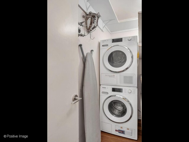 211 E Ohio St Unit 2707, Chicago, IL 60611 - laundry area featuring estacked washer and dryer and wood finished floors