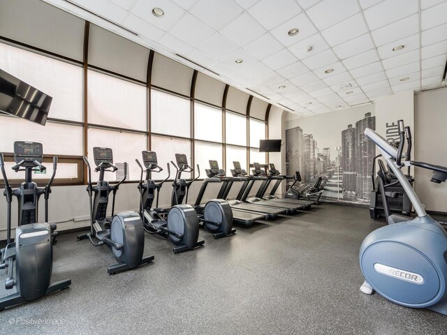 211 E Ohio St Unit 2707, Chicago, IL 60611 - exercise room with healthy amount of natural light and a drop ceiling