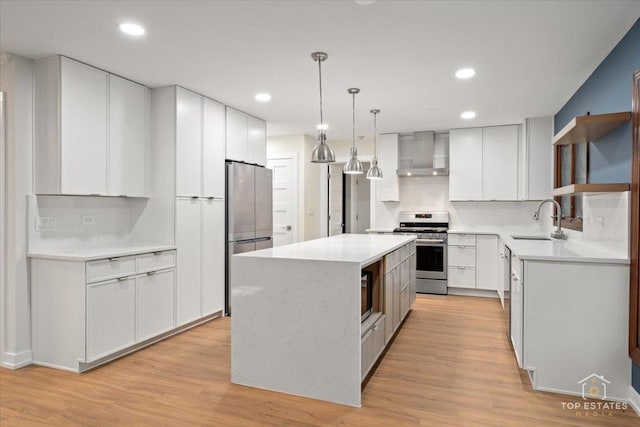21824 Cambridge Dr, Kildeer, IL 60047 - kitchen featuring appliances with stainless steel finishes, wall chimney range hood, a center island, open shelves, and white cabinets