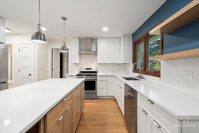 21824 Cambridge Dr, Kildeer, IL 60047 - kitchen featuring wall chimney exhaust hood, stainless steel appliances, light countertops, light wood-style floors, and decorative light fixtures
