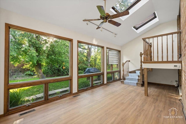21824 Cambridge Dr, Kildeer, IL 60047 - unfurnished sunroom with a skylight, healthy amount of natural light, and lofted ceiling